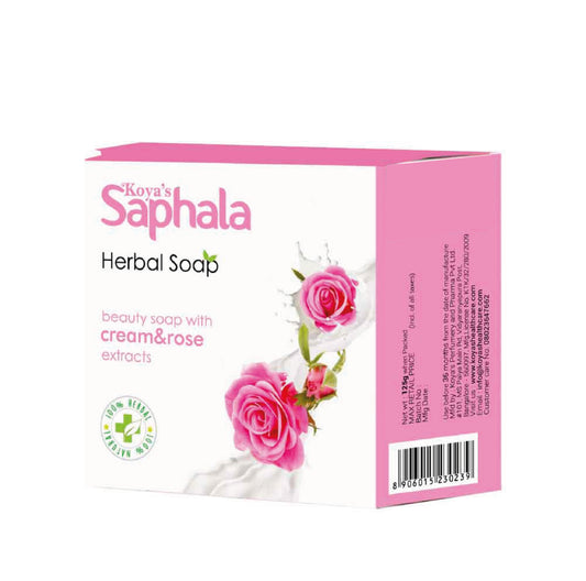 Box of Koya's Saphala cream and rose soap with pink roses splashing into cream on the packaging. The label highlights its cream and rose extracts and features a 100% natural herbal logo.