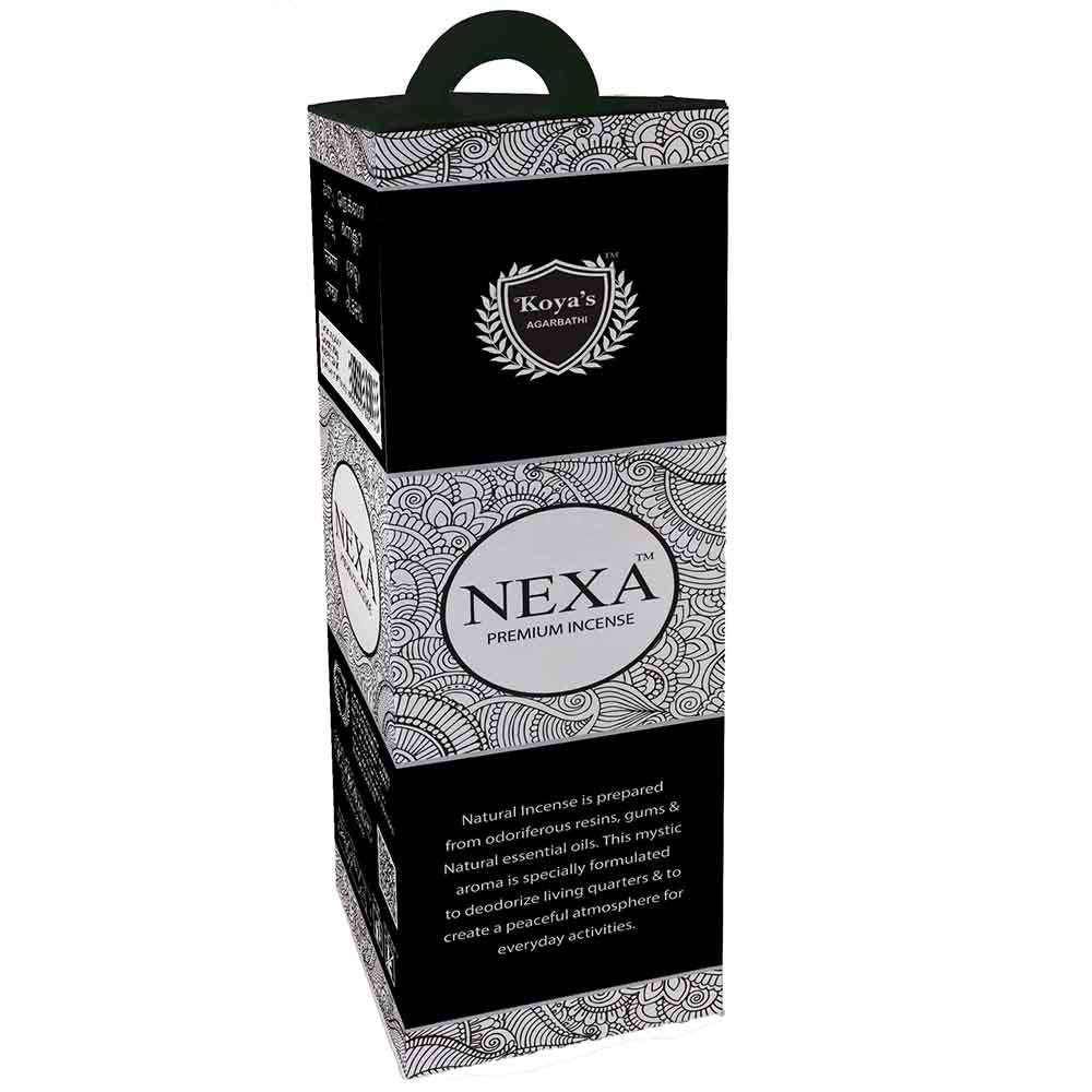 Tall black and white hexagonal box of Koya's Nexa premium incense, featuring an intricate mandala pattern and a carrying handle. The packaging includes the Koya's Agarbathi crest and describes the mystic aroma as ideal for creating a peaceful atmosphere.
