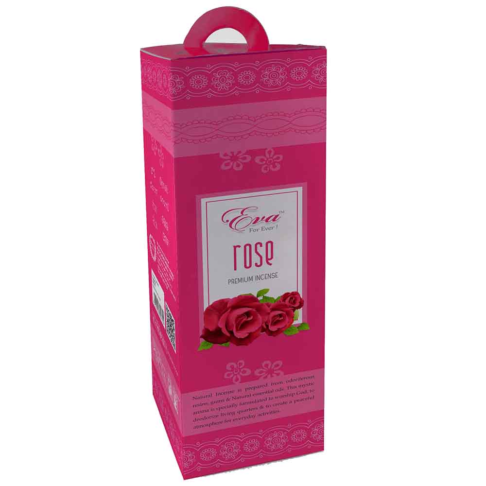 Tall pink box of Eva rose premium incense with a floral pattern and carrying handle. The front label features an illustration of three red roses and describes the natural aroma as ideal for worship and peaceful everyday activities.