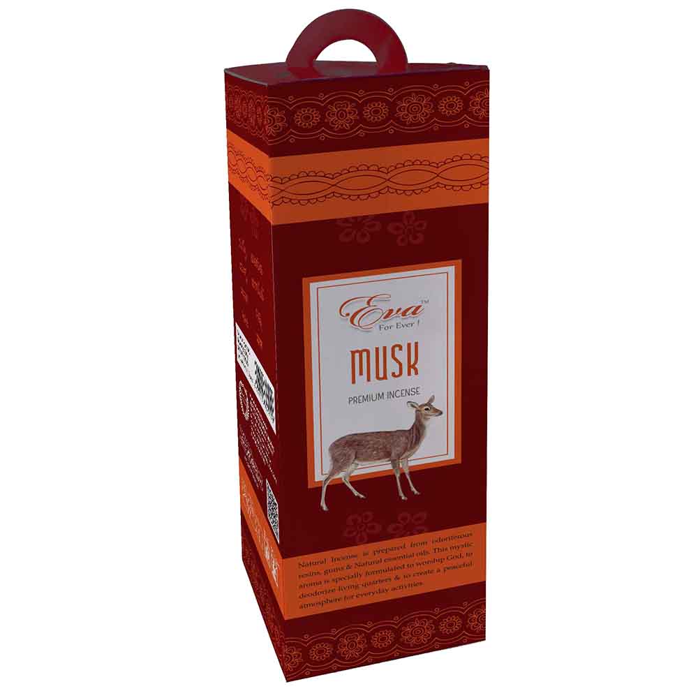 Tall red and orange hexagonal box of Eva musk premium incense with a floral pattern and carrying handle. The front label features an illustration of a musk deer and describes the mystic aroma as ideal for worship and creating a peaceful atmosphere.