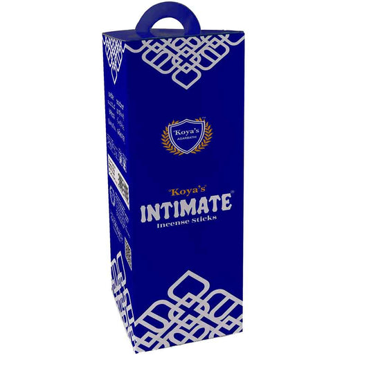 Tall, royal blue hexagonal box of Koya's Intimate incense sticks with a carrying handle. The elegant packaging features a white geometric pattern and the Koya's Agarbathi crest above the product name.