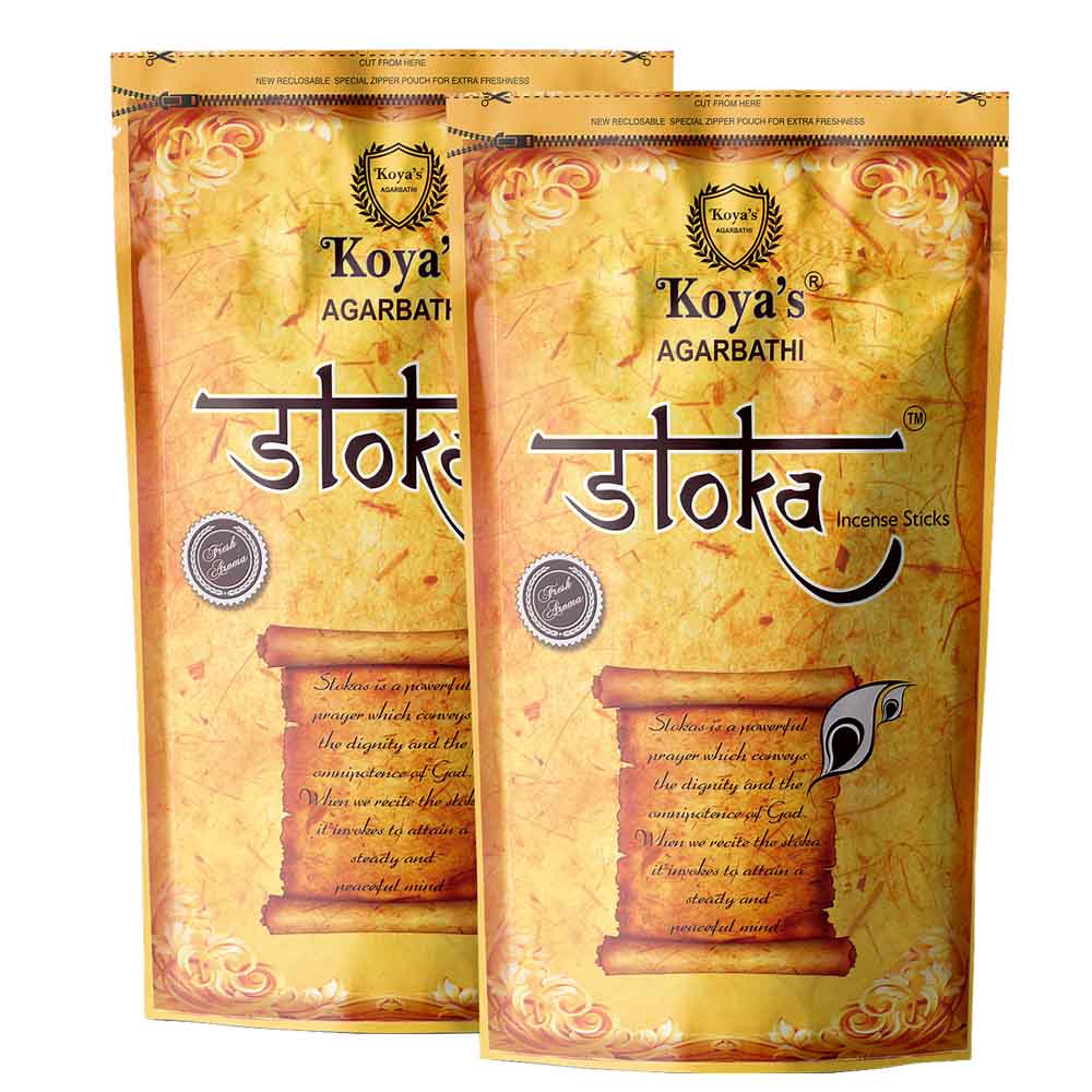 Two pouches of Koyas Sloka incense sticks in a golden-yellow, parchment-textured zipper pouch. The packaging features the Koyas Agarbatti crest and an illustration of a scroll describing a 'sloka' as a prayer for attaining a steady and peaceful mind.