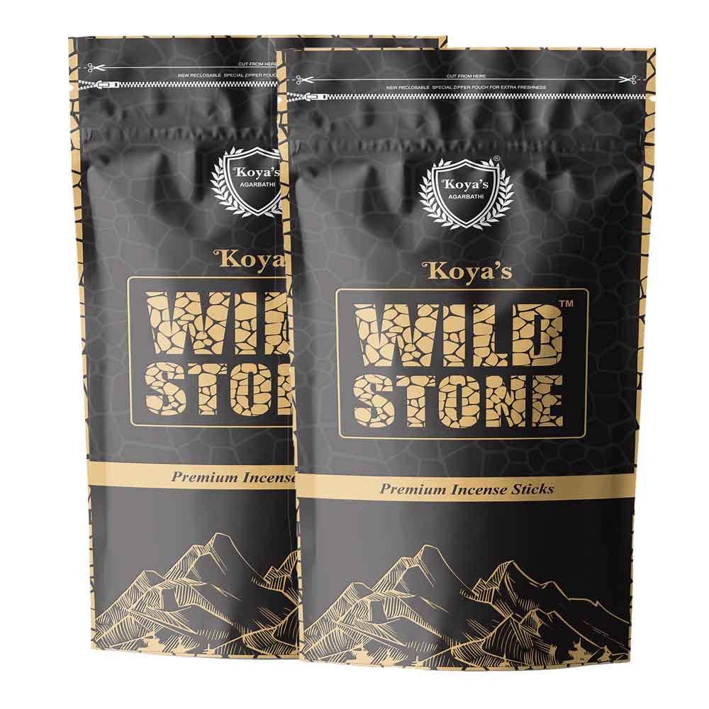 Two pouches of Koyas Wild Stone premium incense in a black zipper pouch with a subtle stone pattern. The packaging features the Koya's Agarbatti crest, the brand name in a rugged textured font, and a gold line-art illustration of a mountain range.