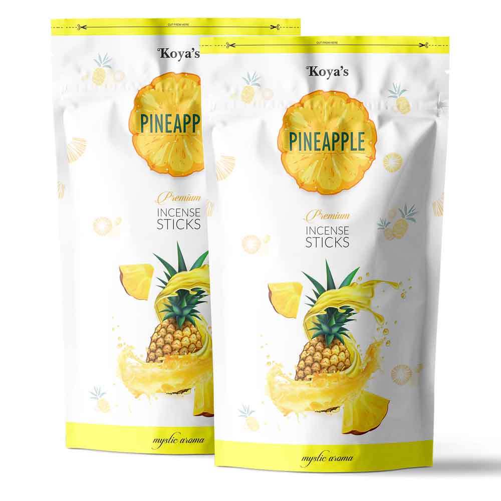 Two pouches of Koyas pineapple incense sticks in a white and yellow resealable zipper pouch. The packaging features a vibrant illustration of a pineapple splashing in juice and describes the scent as a 'mystic aroma'.